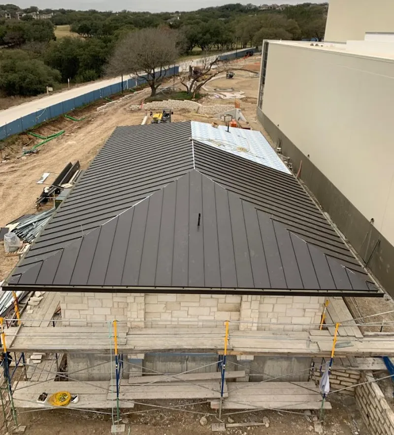 Metal roof new construction with scaffolding in Summit